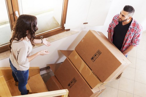 Professional movers packing and loading items